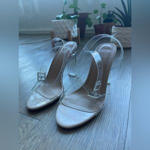Nude/ clear heels with silver buckle. Women’s size 6. True to size. Like new.